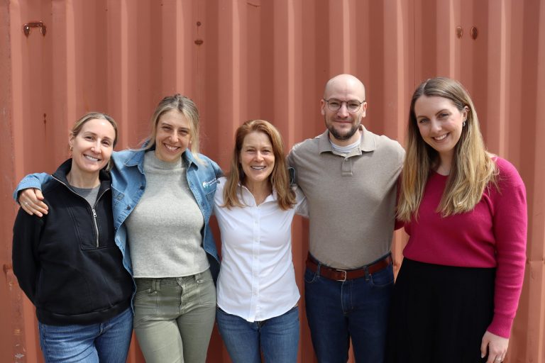 Ivy standing with four former externs