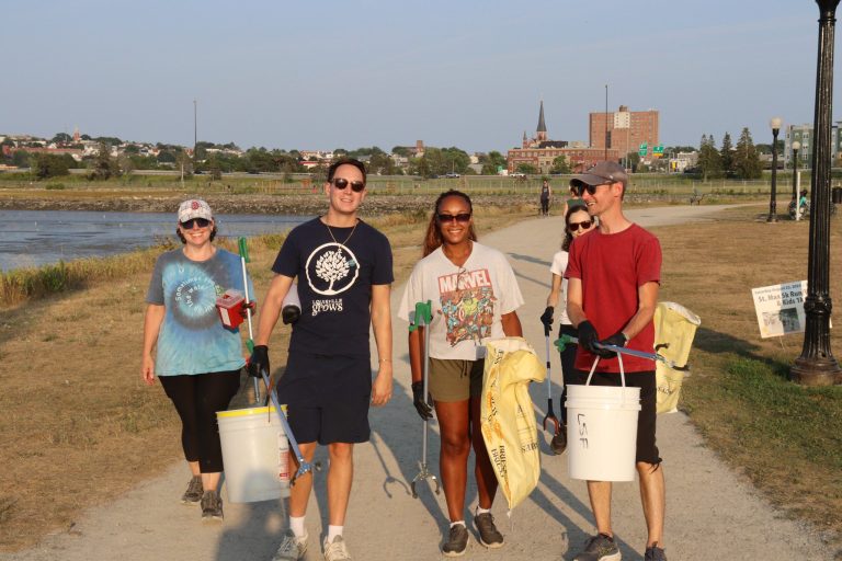 4 friends cleaning up a trail