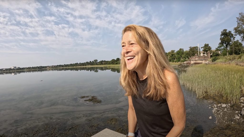 Ivy smiling. Water background.
